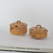 two serving bowls one spoon notch