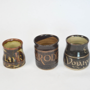 Three mugs small to large with text